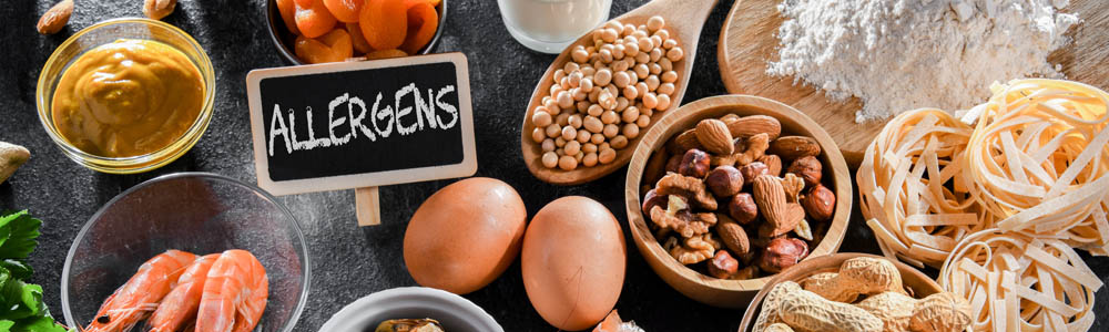 Main allergens - including nuts, eggs, and mustard - on a black counter